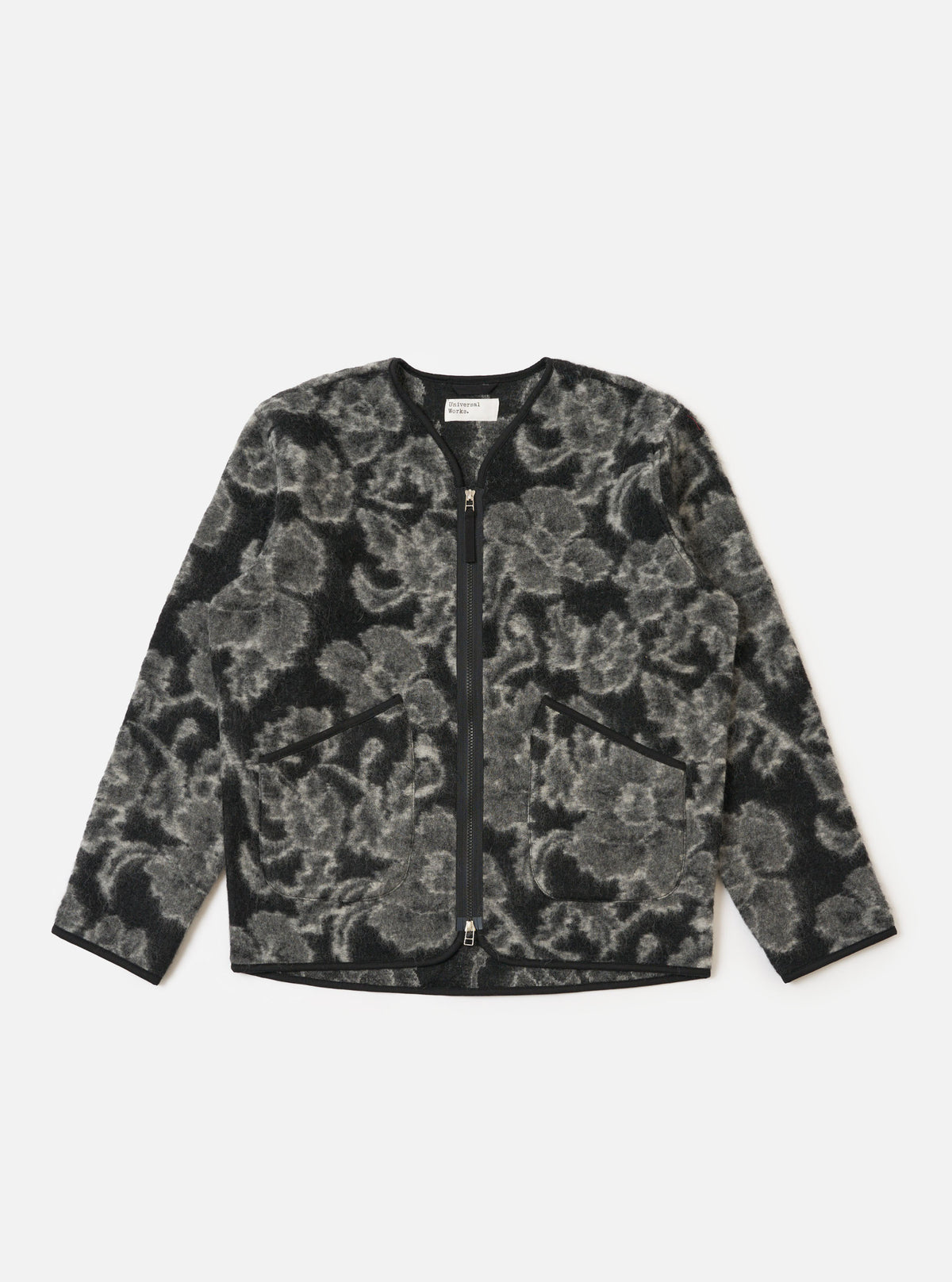 The Charcoal Flower Fleece Zip Liner Jacket is displayed on a white background. The jacket is black and gray with a floral pattern and a full zipper.