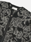 Close-up of the Charcoal Flower Fleece Zip Liner Jacket on a white background. The jacket has a black and gray floral pattern and a black zipper.