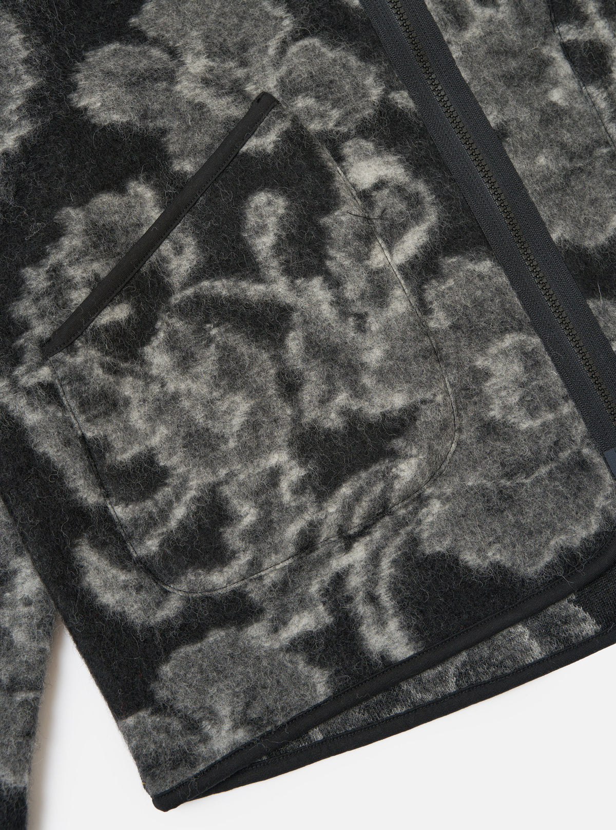 Close-up of the Charcoal Flower Fleece Zip Liner Jacket showing the fleece material, zip, and pocket on a white background.