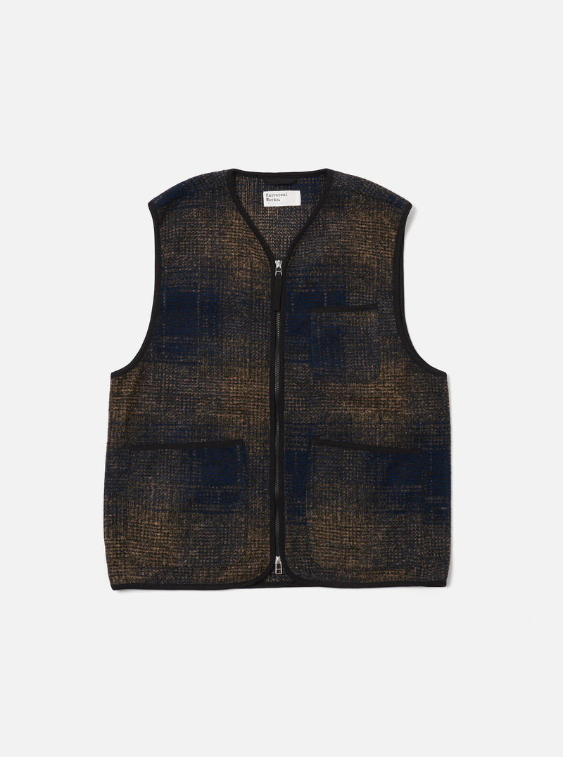 The Navy Deca Check Zip Gilet, a stylish vest with a blue and brown check pattern, is laid flat on a white background. It features a full zip and two front pockets.