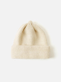 Close-up of an Ecru Alpaca/British Wool Bobble Hat on a white background. The knitted hat is soft and warm, perfect for winter.