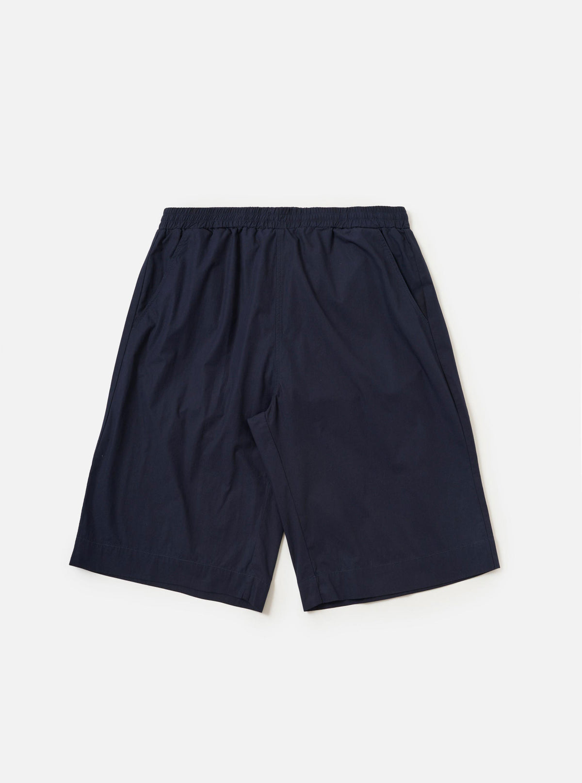 A pair of navy blue paper touch cotton vacation shorts is shown laid flat against a solid white background. The shorts feature an elasticated waistband with a tonal drawstring and a relaxed, wide-leg cut.