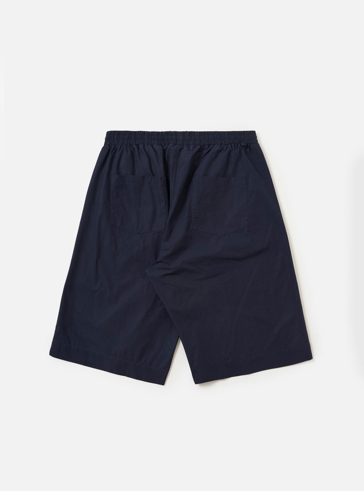 The back of the Navy Paper Touch Cotton Vacation Short is displayed flat against a plain white background. The image highlights the elasticated waistband and two rear pockets, one being a patch pocket with a button closure.