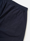 A pair of Navy Paper Touch Cotton Vacation Shorts is shown from the back, laid flat against a solid white background. The image highlights the two rear patch pockets and the elasticated waistband.