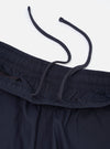 A pair of navy paper touch cotton vacation shorts is shown from a rear perspective, laid flat against a plain white background. The image highlights the two rear patch pockets and the elasticated waistband of the dark blue garment.