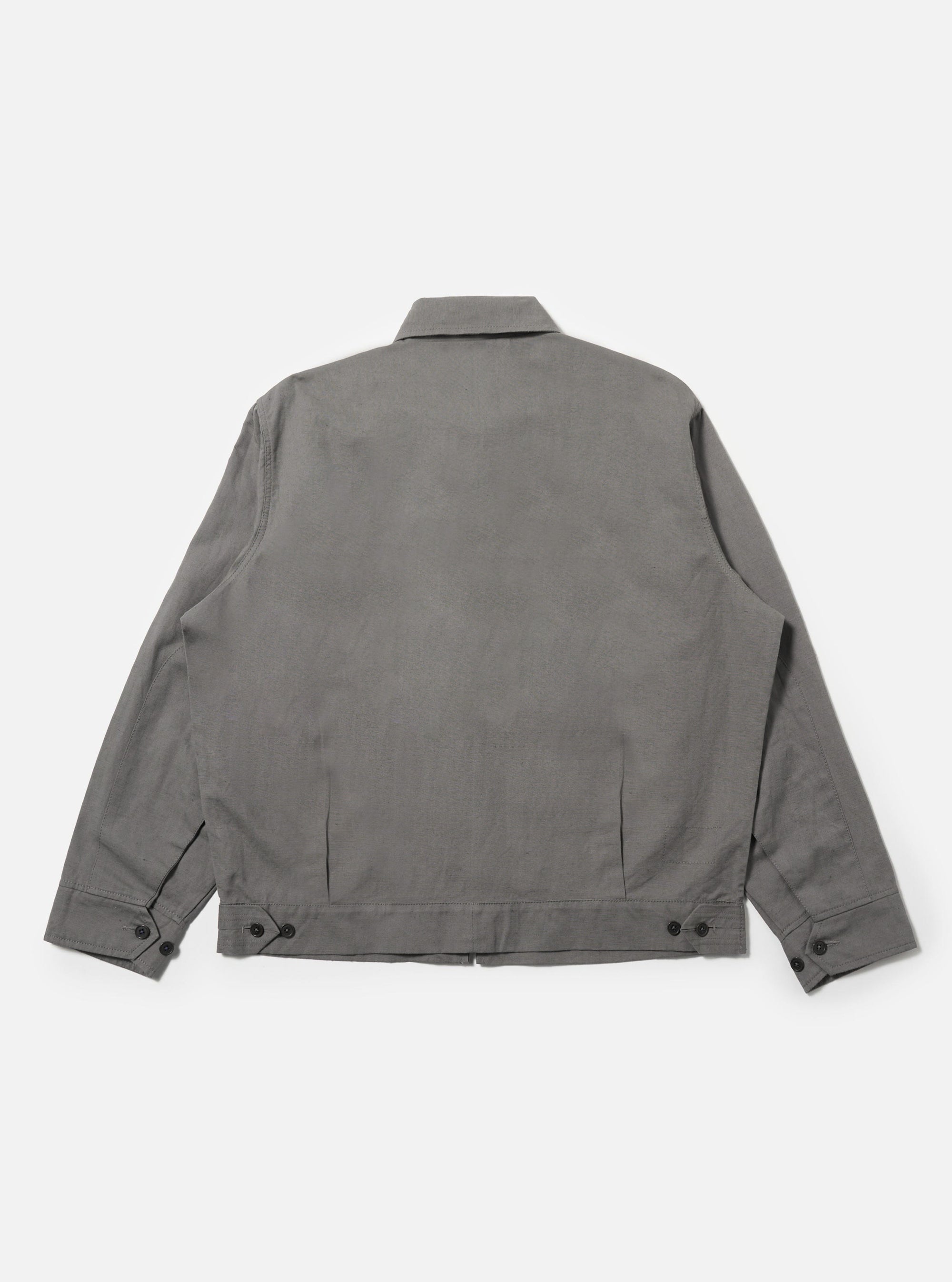 The Mid Grey Linen Slub Weave E130 Jacket is shown from the back, laid flat against a plain white background. The image highlights the straight hem, the back of the collar, and the textured slub weave of the mid-grey fabric.