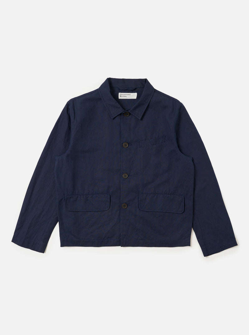 The Navy Linen Slub Weave Franck Jacket is displayed as a flat lay against a plain white background. The jacket features a full button-down front, a classic one-piece collar, and three practical patch pockets, including one on the left chest. The deep navy blue fabric has a visible textured, slubbed appearance.