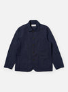The Navy Linen Slub Weave Bakers Jacket is shown as a flat lay against a plain white background. The jacket features a five-button front closure, a notched collar, and four front patch pockets: one at the chest and three at the waist, including a smaller ticket pocket. The navy fabric has a visible textured slub weave throughout.