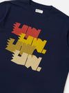 The Navy Single Jersey Multi UW Print Multi UW Print Tee is shown from a rear perspective, laid flat against a solid white background. The image highlights the straight hem, short sleeves, and the continuation of the white "UW" logo print across the back of the navy blue cotton fabric.
