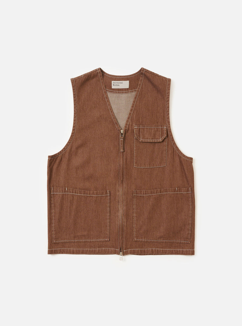 A Brown Meco Denim Marine Gilet is displayed flat against a plain white background. The garment features a button-down front, a simple v-neckline, and two large patch pockets at the waist. The brown denim fabric shows a visible texture.