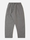 A pair of mid-grey linen slub weave Oxford pants is displayed flat against a plain white background. The trousers feature a wide-leg cut, an elasticated waistband with a matching grey drawstring, a single front pleat, and side pockets. The fabric shows a visible slub texture.
