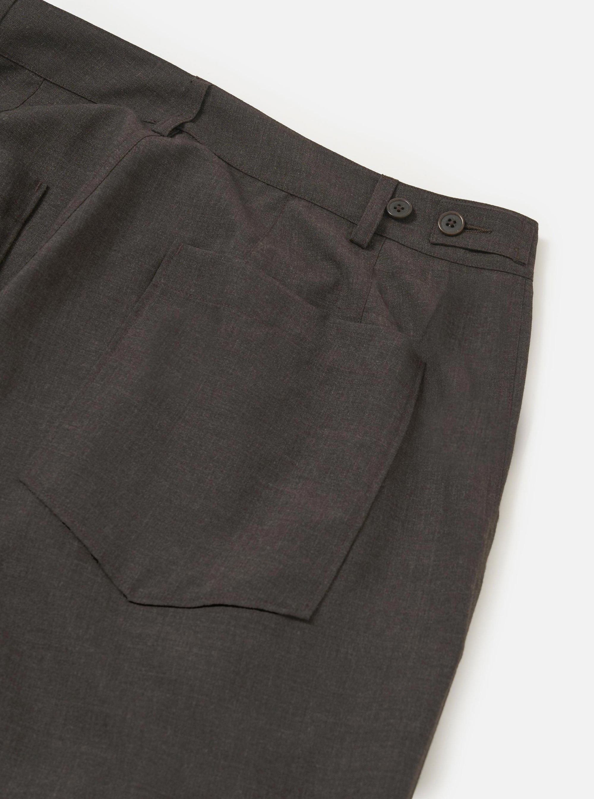 The Brown Marl Tropical Suiting Dutch Pant is shown from the back, laid flat against a plain white background. The image highlights the wide-leg silhouette, a single rear patch pocket on the right side, and a simple waistband with belt loops.