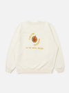 The Ecru Brush Back Sweat FM Raglan Sweatshirt is shown from the back, laid flat against a plain white background. The image highlights the raglan sleeve construction, ribbed cuffs, and a ribbed hem.