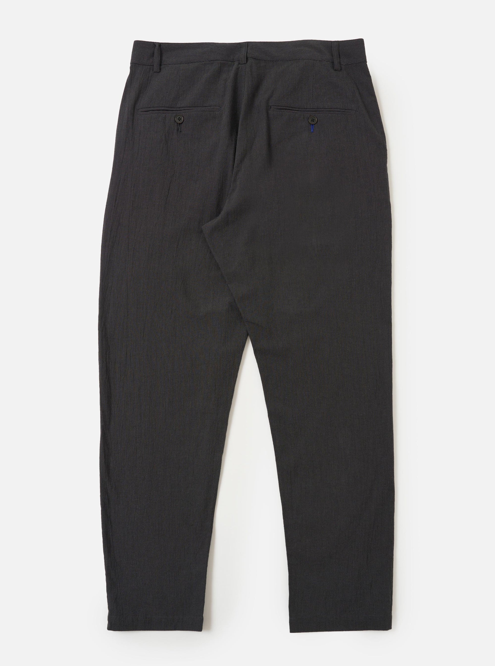 The back of the charcoal grey cotton military chinos is displayed flat against a plain white background. The trousers feature a straight leg and two rear pockets with buttoned flaps.
