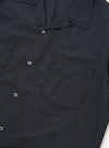 The Navy Check Plaid Summer Overshirt is shown from the back, laid flat against a solid white background. The image highlights the back yoke and the clean, straight hem of the garment, showcasing the dark navy and white plaid pattern.