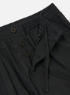 A pair of Black Broadcloth Oxford Pants is displayed from a rear view, laid flat against a solid white background. The trousers feature a wide-leg silhouette, an elasticated waistband with an internal drawstring, and a single rear buttoned flap pocket.