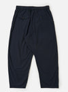 A pair of Navy Broadcloth Oxford Pants is shown from the back, laid flat against a plain white background. The navy blue trousers feature a wide-leg silhouette and a clean waistband with a single rear buttoned pocket.