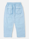 A pair of Pale Blue Linen Cotton Shirting Parachute Pants is shown from the back, laid flat against a solid white background. The trousers feature a relaxed, straight-leg silhouette and a visible drawstring at the waistband.