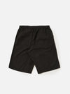 A pair of Black Broadcloth Vacation Shorts is shown from the back, laid flat against a plain white background. The shorts feature a solid black cotton fabric, an elasticated waistband with a drawstring, and a single rear patch pocket on the right side.