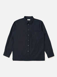 The Navy Broadcloth Lucky Shirt is shown laid flat against a solid white background. The garment is a short-sleeved button-up shirt featuring a classic pointed collar, a full button-down front, and two large patch pockets on the chest. The navy blue broadcloth fabric appears smooth and uniform in color.