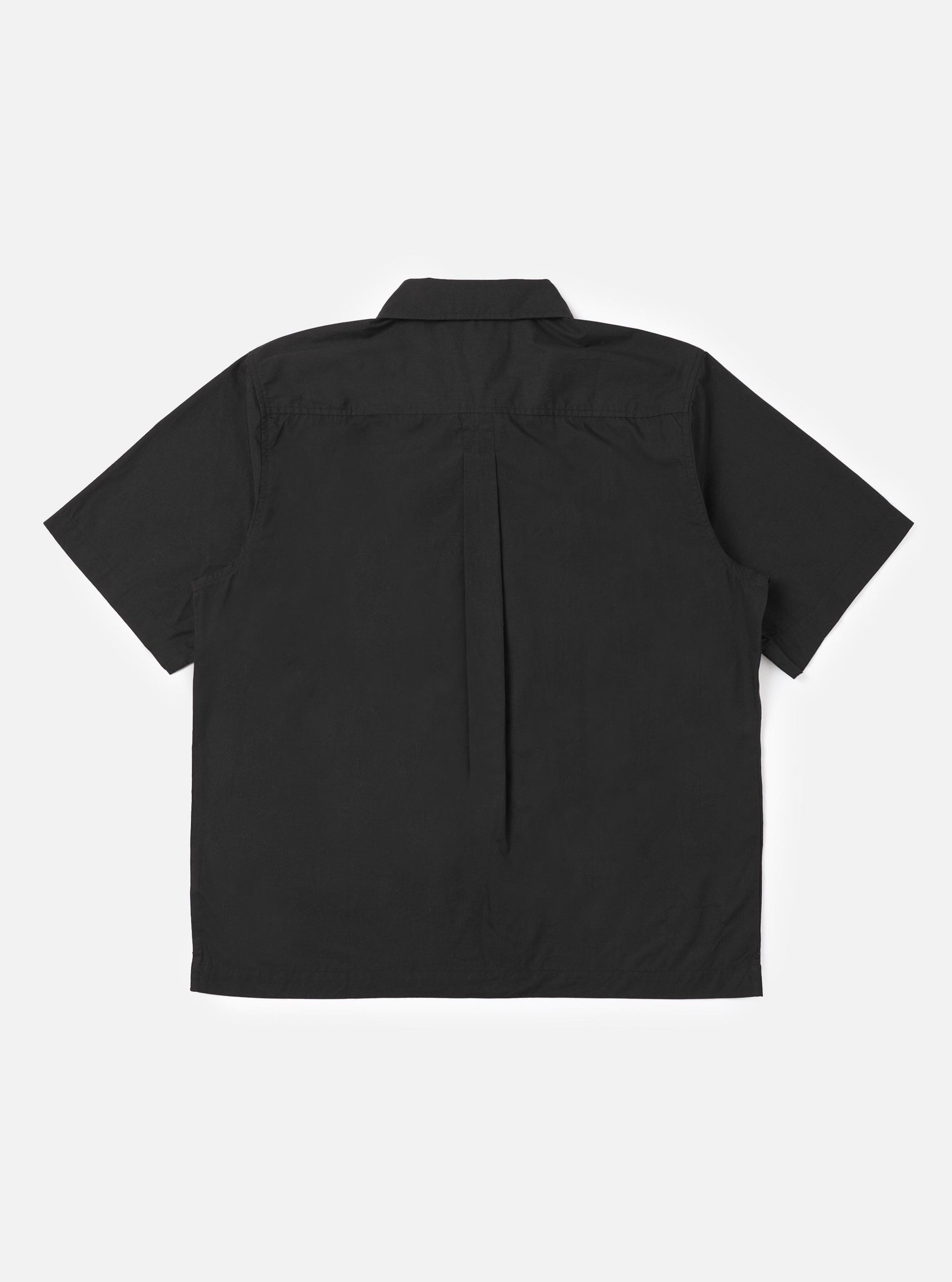 The back of the Black Broadcloth Ewan Shirt is displayed flat against a plain white background. The image highlights the clean construction of the garment's rear, including the back yoke and straight hem.