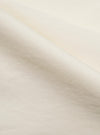 A close-up fabric swatch of the Ecru Broadcloth Ewan Shirt shows a detailed view of the fine, plain-weave cotton fabric. The image highlights the smooth texture and off-white ecru color of the material.