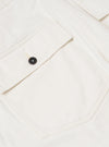 A close-up view of the back of a pair of Ecru Slub Drill Dizzy Trousers, focusing on the waistband and two rear buttoned flap patch pockets. The ecru-colored cotton fabric features a subtle slub texture and is displayed against a plain white background.