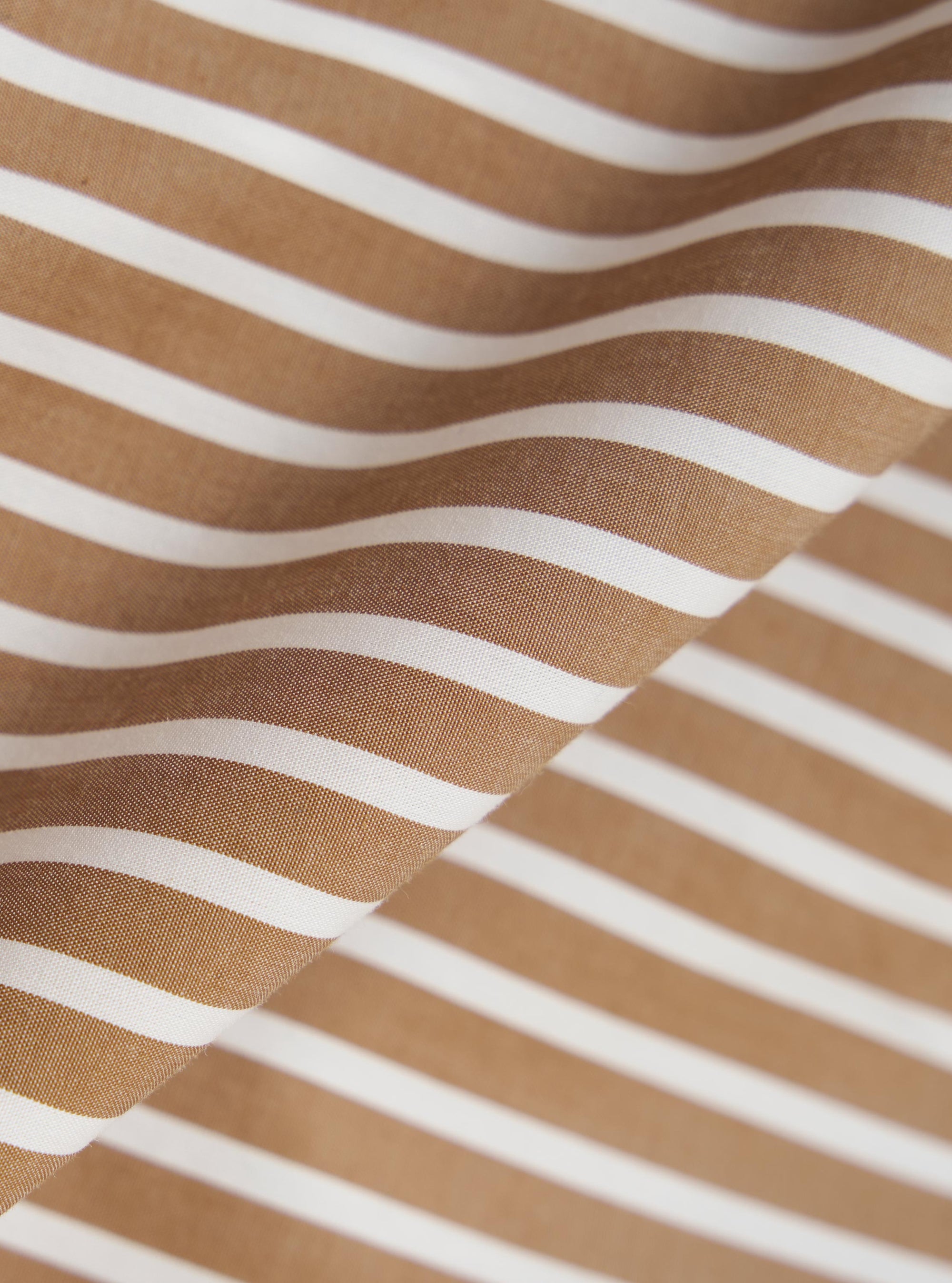 A close-up fabric swatch of the Brown/White Cotton Stripe Square Pocket Shirt, showcasing a pattern of alternating brown and white vertical stripes. The image highlights the fine texture of the cotton material.