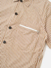 The Brown/White Cotton Stripe Z Tech Overshirt is shown from the back, laid flat against a plain white background. The garment features a vertical brown and white stripe pattern, a straight hem, and a simple collar.