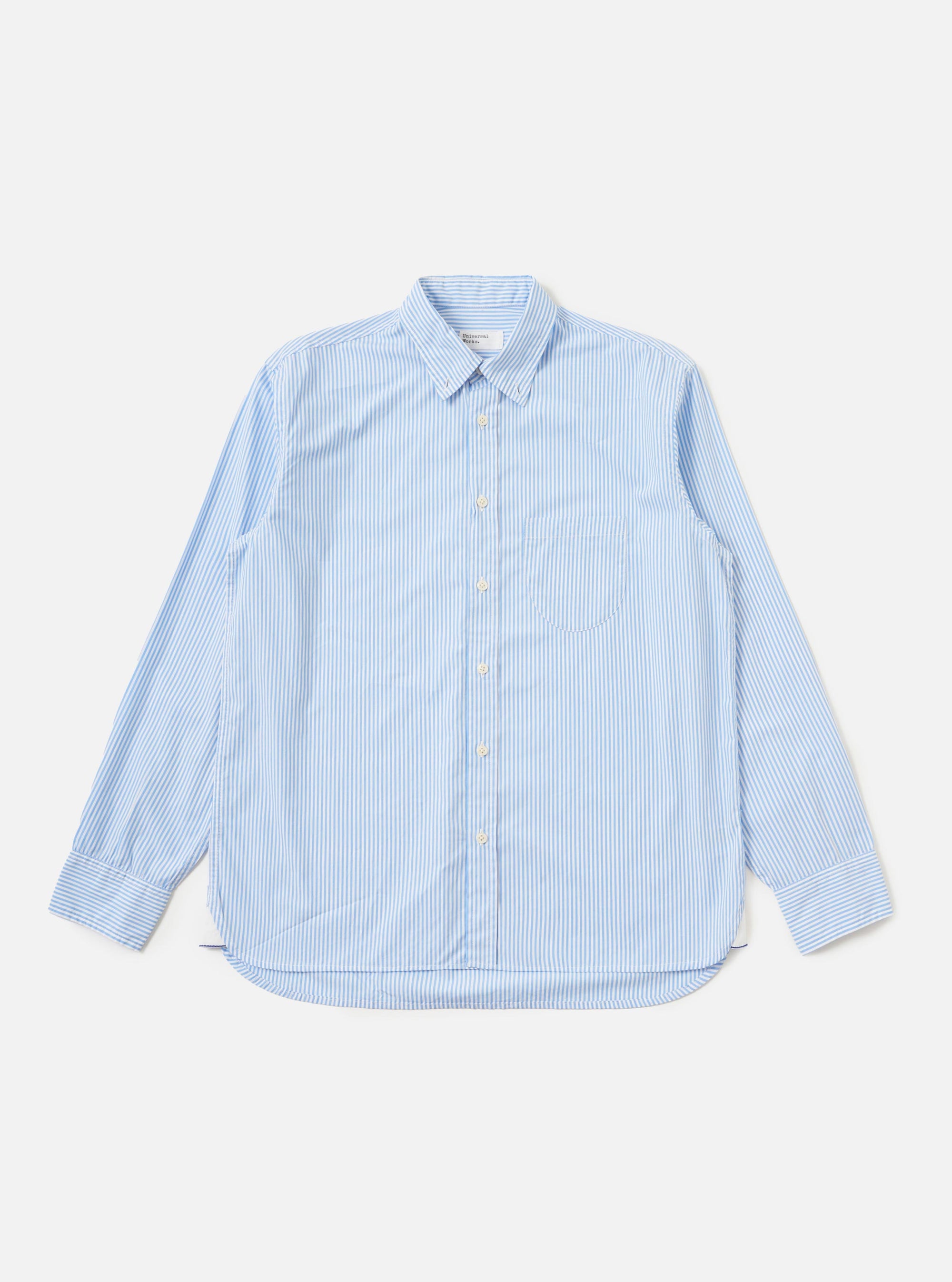 The Sky/White Classic Nipon Stripe Lazy Day Shirt is displayed flat against a plain white background. The shirt features a sky blue and white vertical stripe pattern, a classic pointed collar, a full button-down front, and a single chest pocket on the left side.
