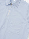A rear view of the Sky/White Classic Nipon Stripe Ewan Shirt is shown laid flat against a plain white background. The image highlights the blue and white vertical stripes, a straight hem, and a simple horizontal yoke across the shoulders.