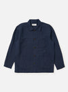 The Navy Linen Cotton Shirting Bakers Overshirt is displayed flat against a plain white background. The garment features a classic collar, a full button-down front, and three prominent patch pockets on the torso. The fabric has a visible textured linen-cotton weave in a deep navy blue color.
