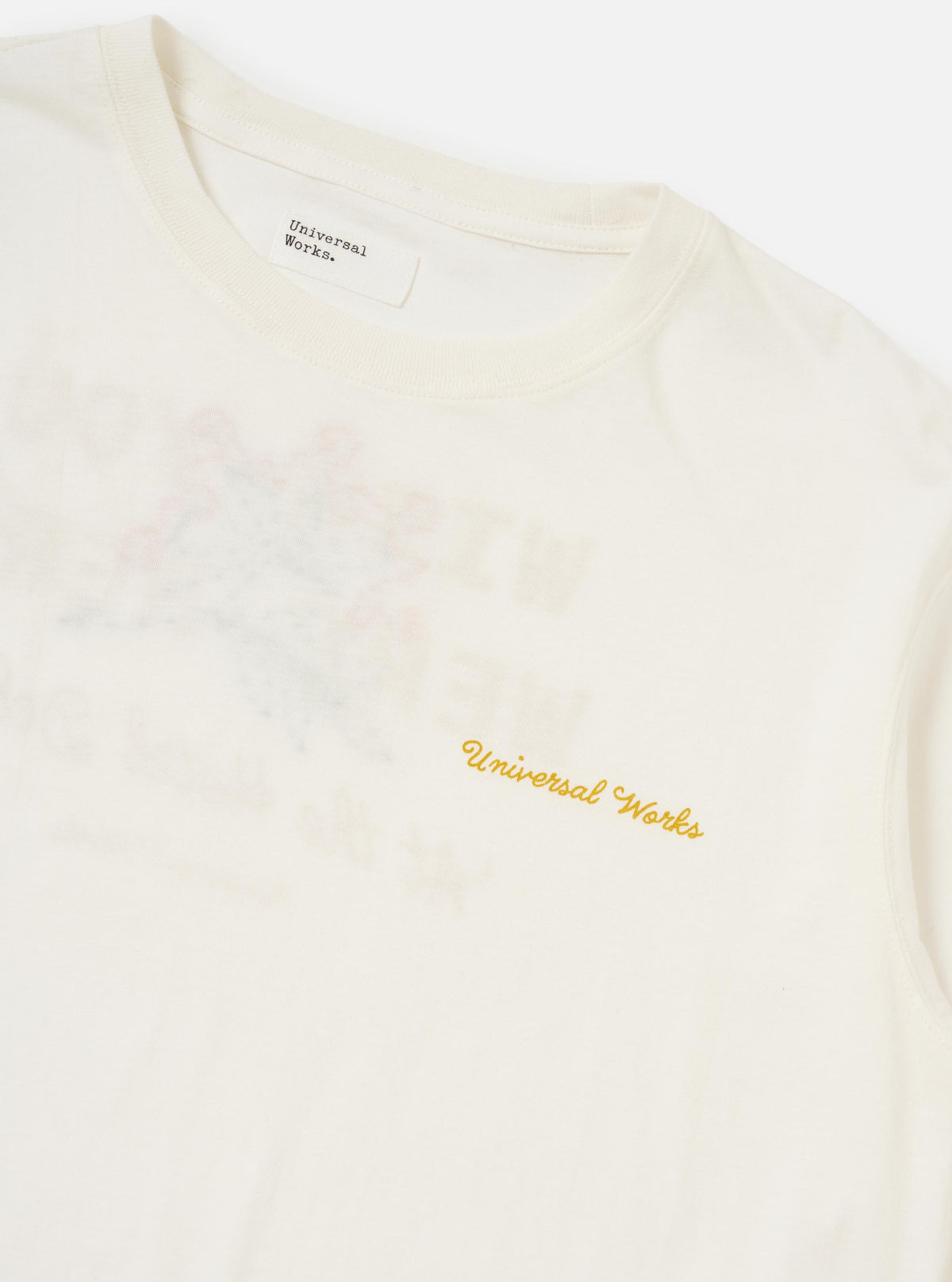 The Ecru Single Jersey Wish Wish You Were Here Tee is shown from the back, laid flat against a plain white background. The image prominently features a large "Wish You Were Here" printed graphic centered on the back, accompanied by a hand-embroidered floral spray overlay. The t-shirt has a straight hem and short sleeves.