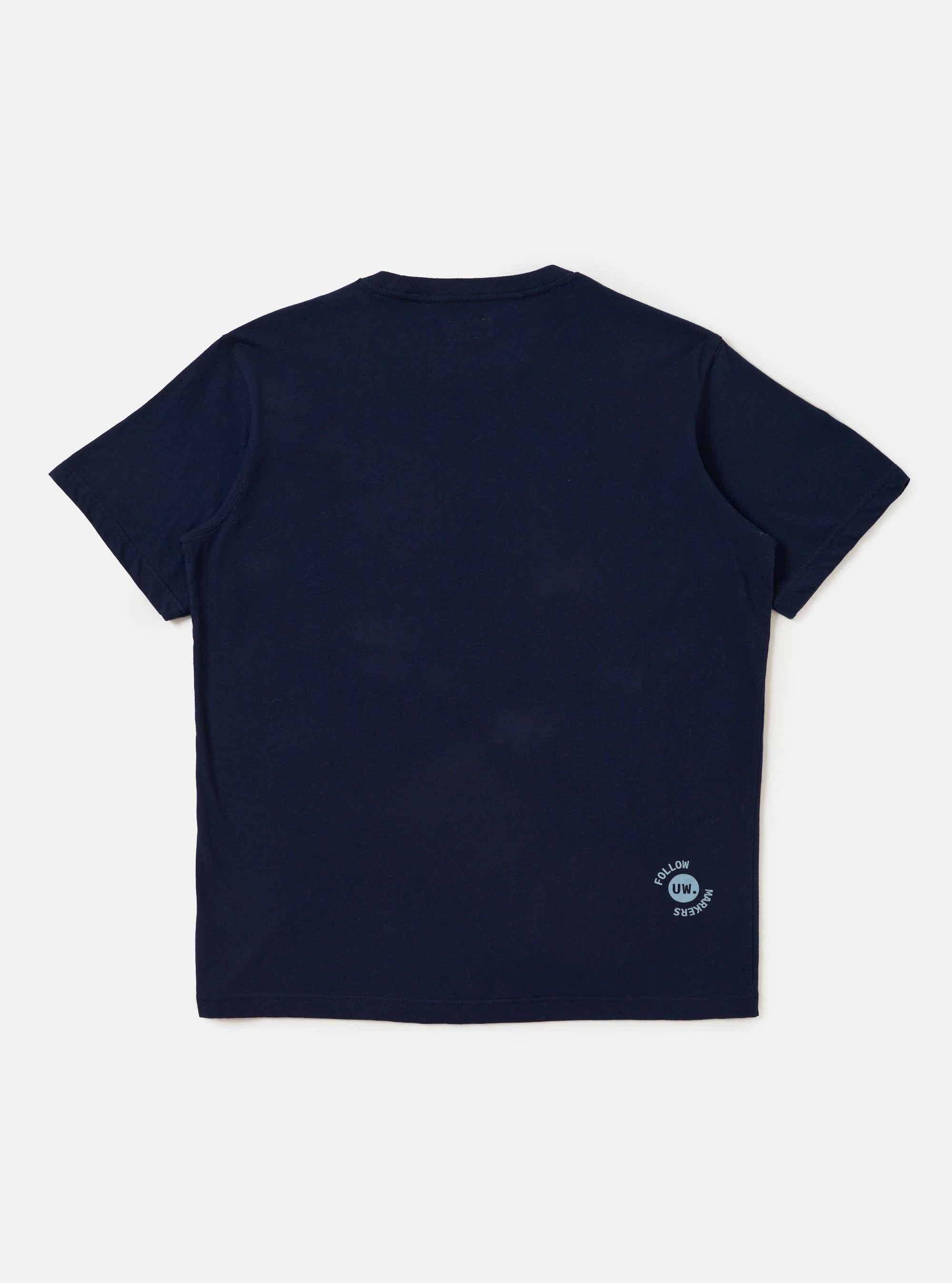 The back of the Navy Single Jersey Trail Trail To Hotel Delux Tee is displayed flat against a plain white background. The navy blue t-shirt features short sleeves and a ribbed crew neckline.