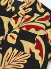 The Black Baja Print Road Shirt is shown from a rear perspective, displayed flat against a plain white background. The image highlights the short sleeves, straight hem, and the all-over patterned Baja print in black and grey.