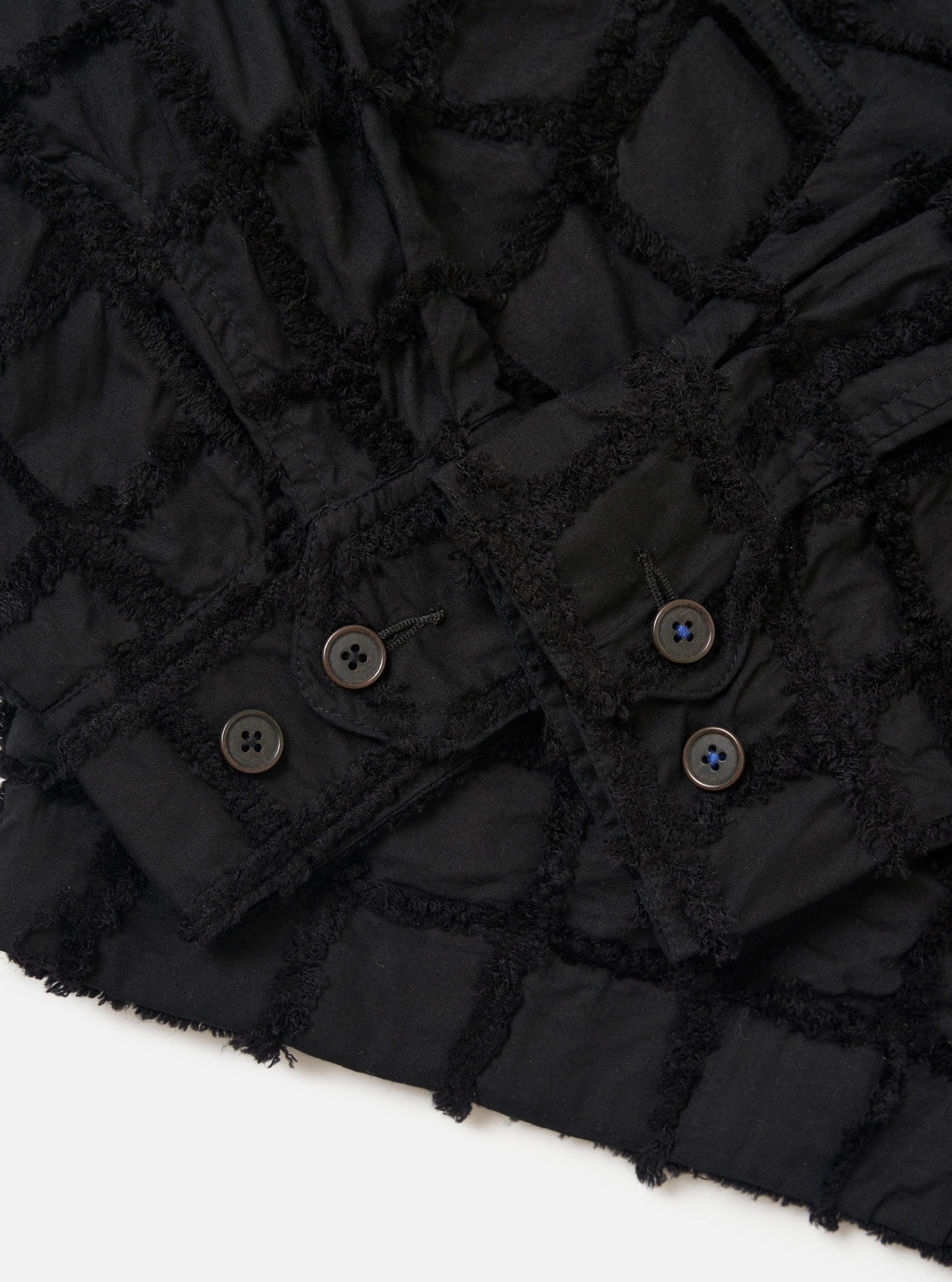 The Black 3D Check Windcheater Jacket is shown from the back, laid flat against a plain white background. The image highlights the straight hem, the subtle texture of the 3D check fabric, and the construction of the sleeves and shoulders.