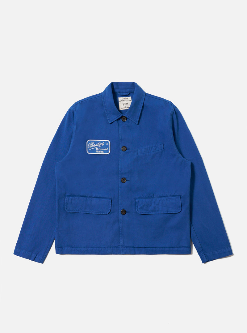 The Paraboot x Universal Works Navy Derek Twill Warmus Jacket is displayed on a white background. The jacket is navy twill with a patch on the chest.
