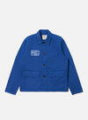 The Paraboot x Universal Works Navy Derek Twill Warmus Jacket is displayed on a white background. The jacket is navy twill with a patch on the chest.