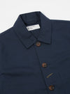Close-up of the Navy Twill Bakers Jacket on a white background. The jacket is navy blue with brown buttons. The twill fabric has a subtle texture.