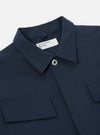 Close-up of the Navy Twill MW Fatigue Jacket on a white background. The jacket features a twill texture, button closure, and chest pockets.