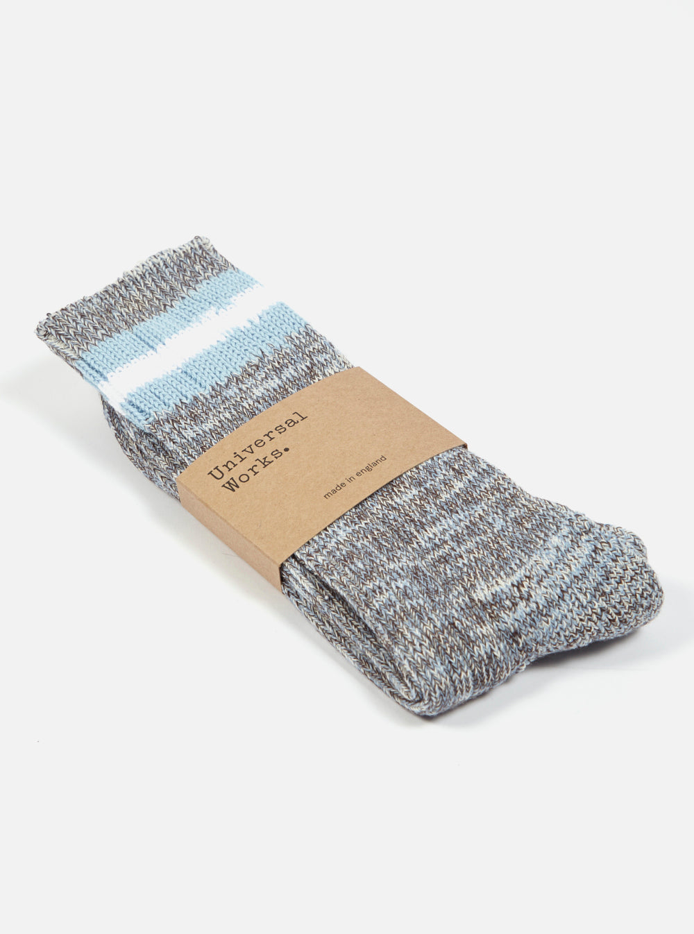 Folded Cornish Blue Cotton Everyday Stripe Sock on a white background. The sock has blue and white stripes at the top and a brown paper label.