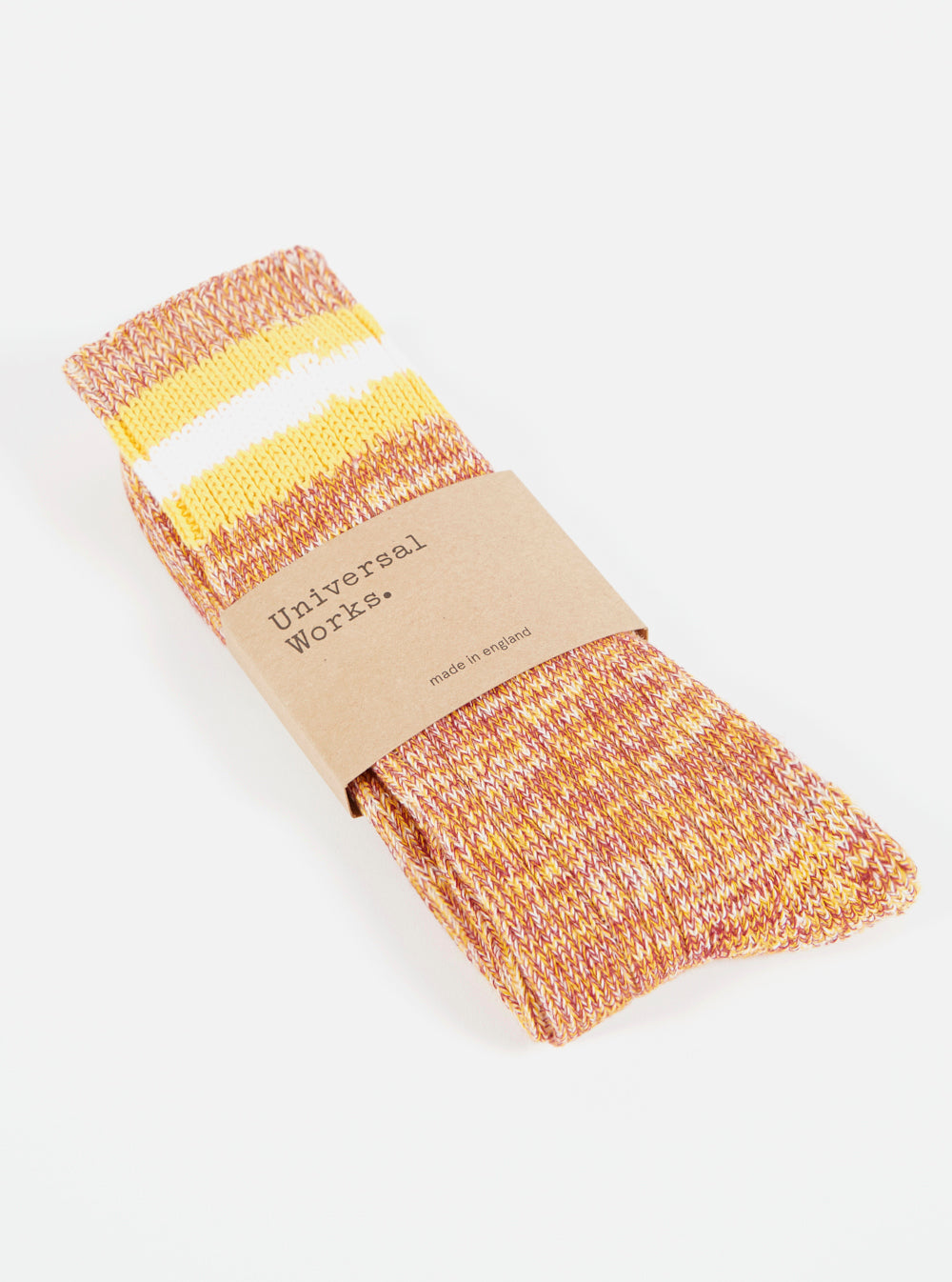 Folded Yellow Cotton Everyday Stripe Sock on a white surface, wrapped in a brown paper label.