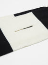 Close up of the Ecru/Black Soft Wool Deluxe Football Scarf on a white background. The scarf is striped with a slot cut out of the ecru section.