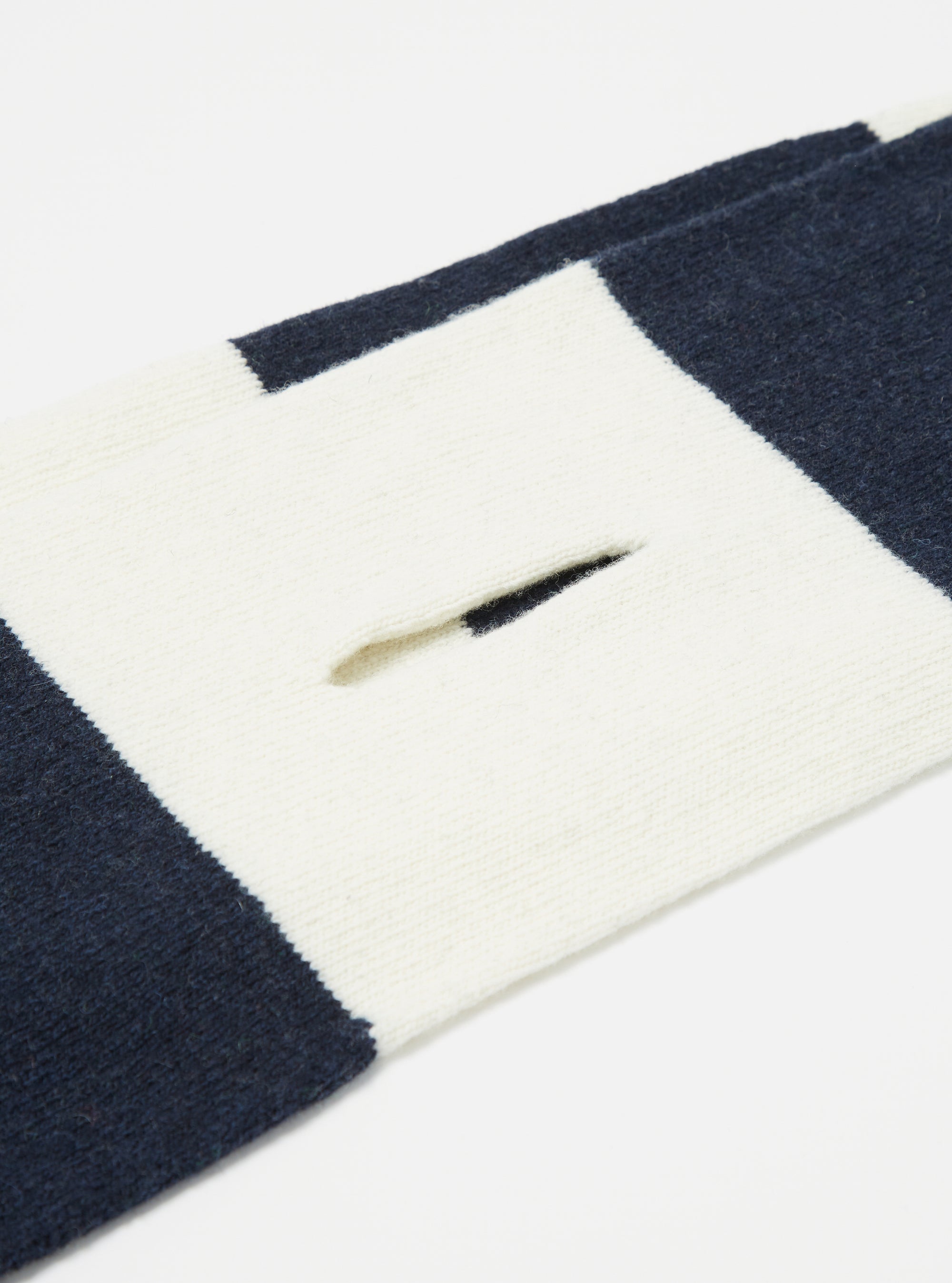 Close-up of the Navy/Ecru Soft Wool Deluxe Football Scarf on a white background, showing the navy and ecru stripes and the soft wool texture.