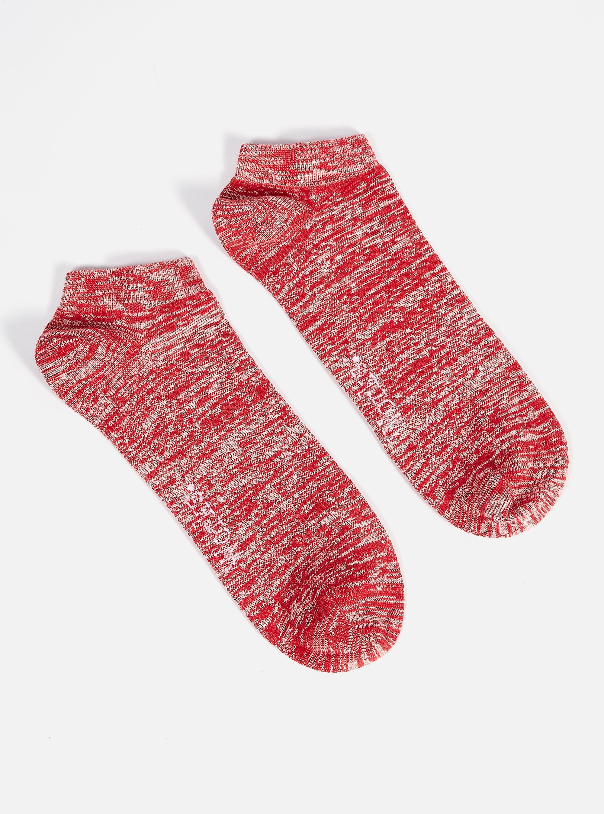 A pair of Red Slub Knit Ankle Slub Sock on a white background. The socks are red and white with a slub knit texture, perfect for a casual, comfortable fit.